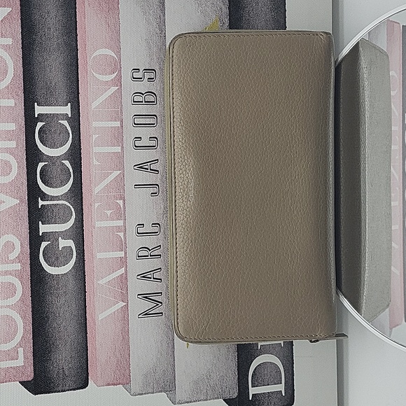 Celine Handbags - Auth . Celine zip around wallet